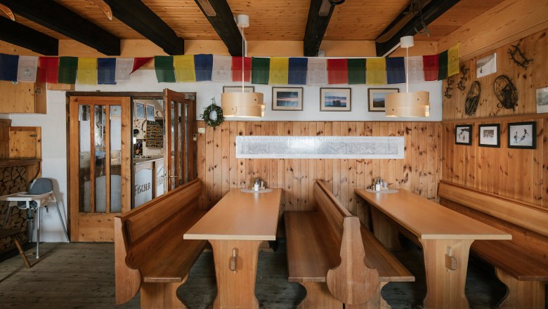 Fisherman's Cabin, Schneeberg, Hut, Schneebergland, Vienna Alps in Lower Austria, © Wiener Alpen/Sophie Menegaldo Cozy dining room at the Fischerhütte on Schneeberg, featuring wooden tables, benches, and traditional decor
