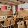 Dining room with wooden tables and chairs featuring a heart motif at the Damb&ouml;ckhaus on Schneeberg