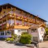 Paradise spring pink house view with wooden balconies