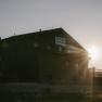 A fisherman's cabin on Schneeberg bathed in the warm light of the low-hanging sun