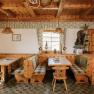 Cozy sitting area with wood paneling at the Almreserlhaus on Schneeberg