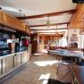 Interior view of a traditional restaurant with wooden furniture and bar.