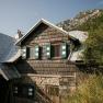 Exterior view of the Edelwei&szlig;h&uuml;tte on Schneeberg, with its shingle facade and green shutters