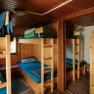 Dormitory room with wooden bunk beds at the Edelwei&szlig;h&uuml;tte on Schneeberg
